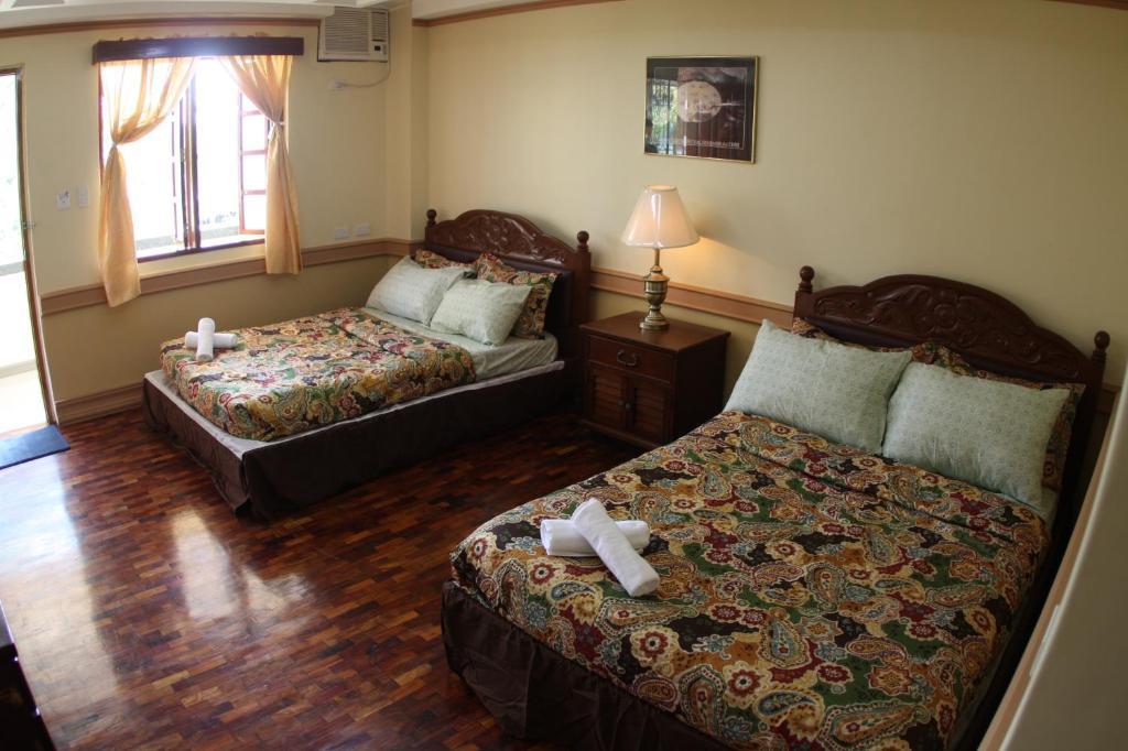 Ascendo Suites Puerto Princesa Habitación foto